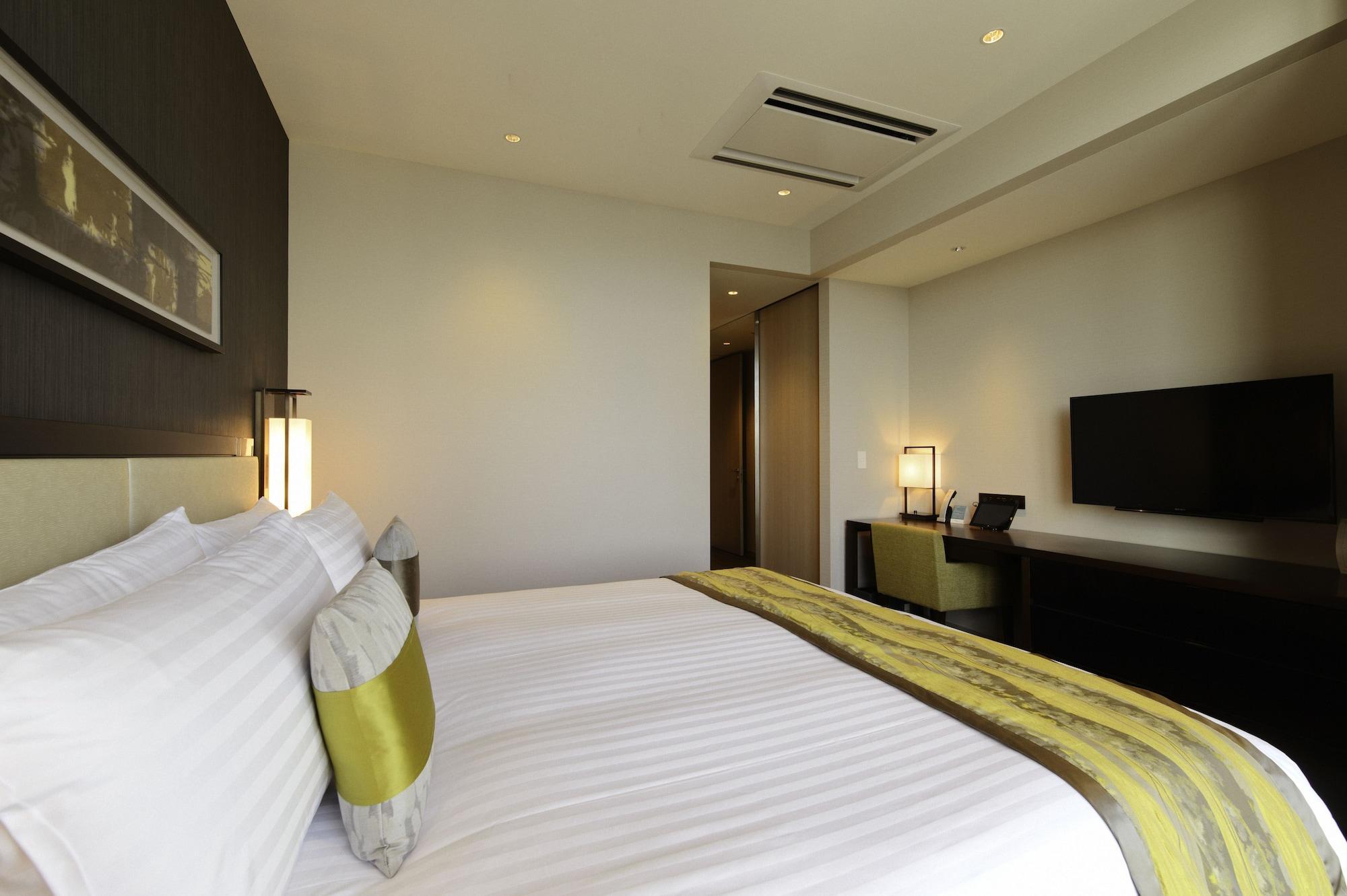 Отель Oakwood Premier Токио Экстерьер фото A room at the hotel