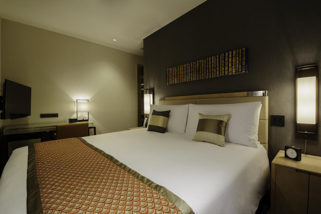 Отель Oakwood Premier Токио Экстерьер фото A bedroom at the hotel